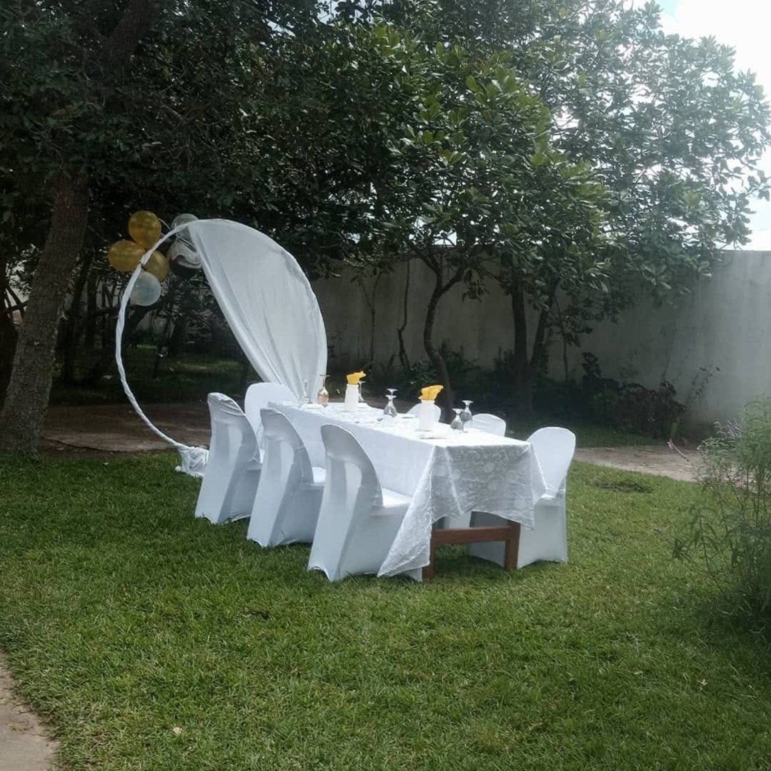 White outdoor celebration table in the garden