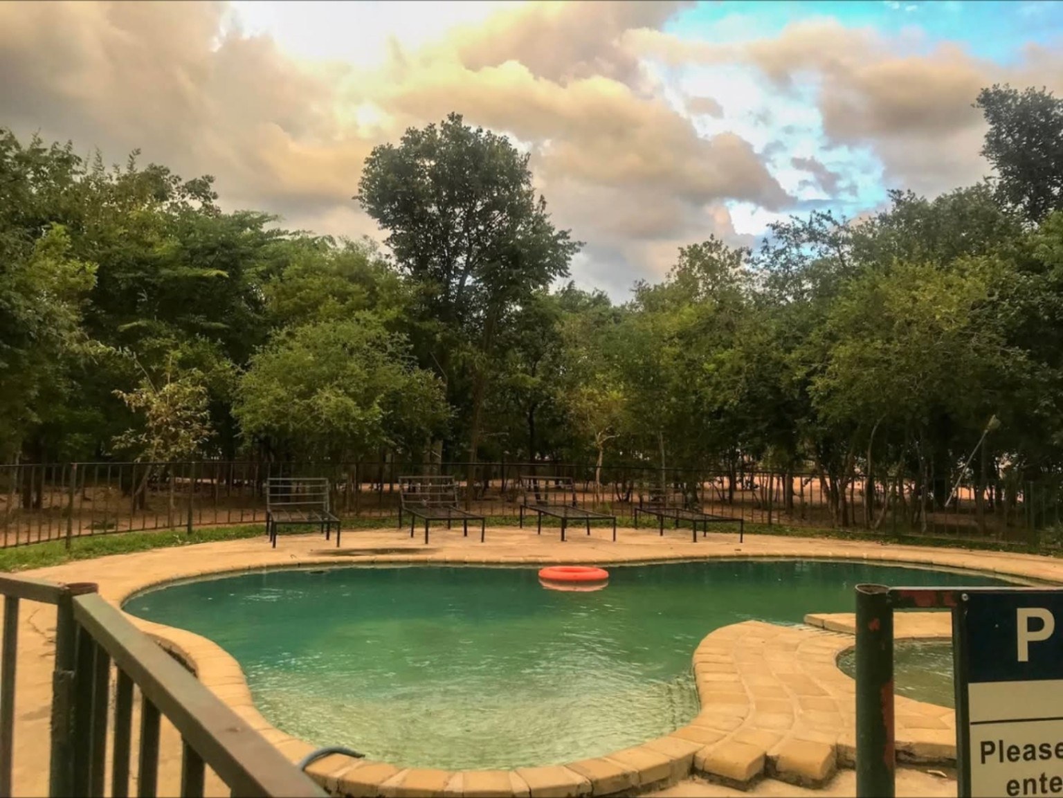 Pool under a golden evening sky