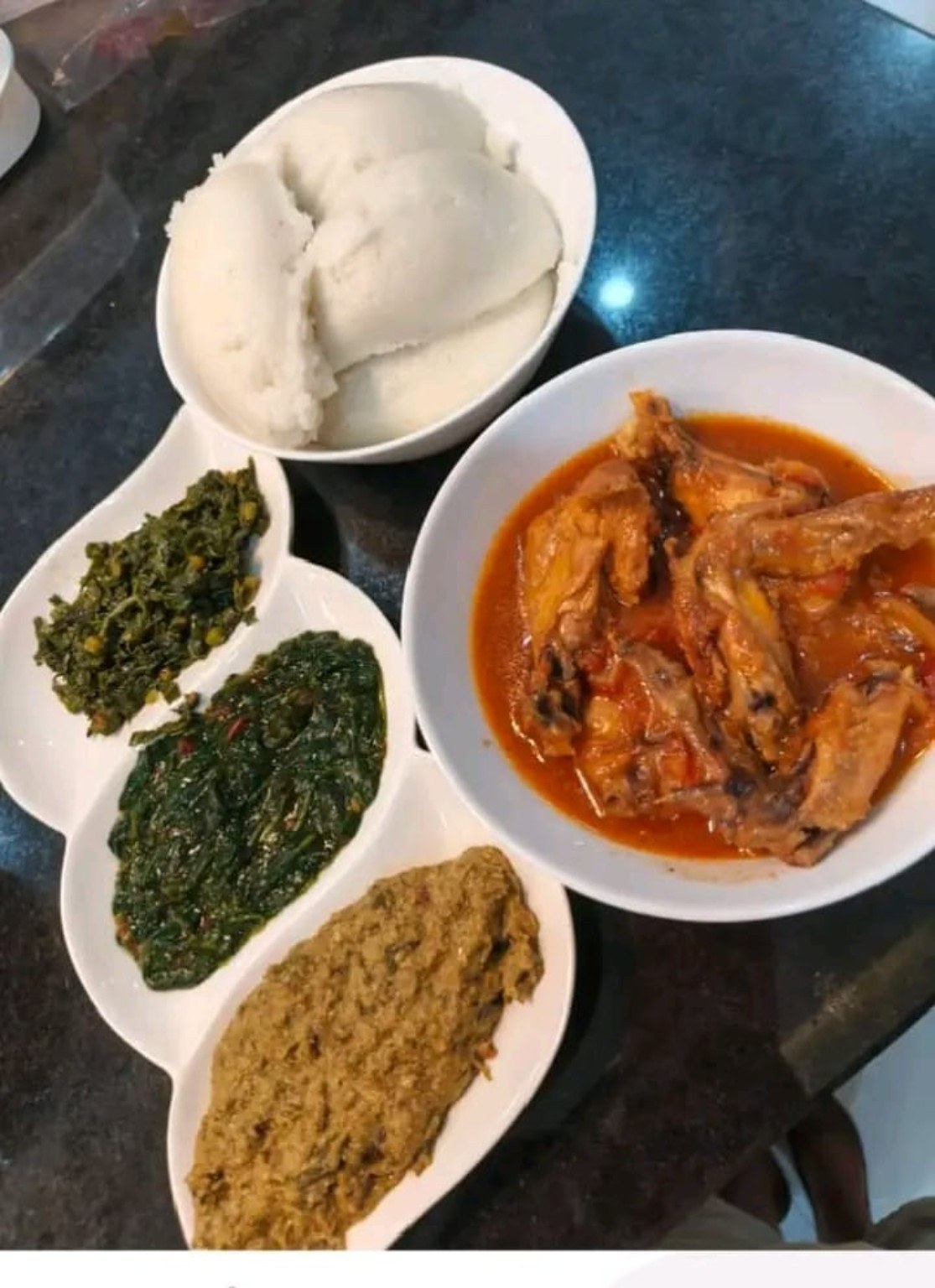 Nshima, chicken and a selection of relishes.