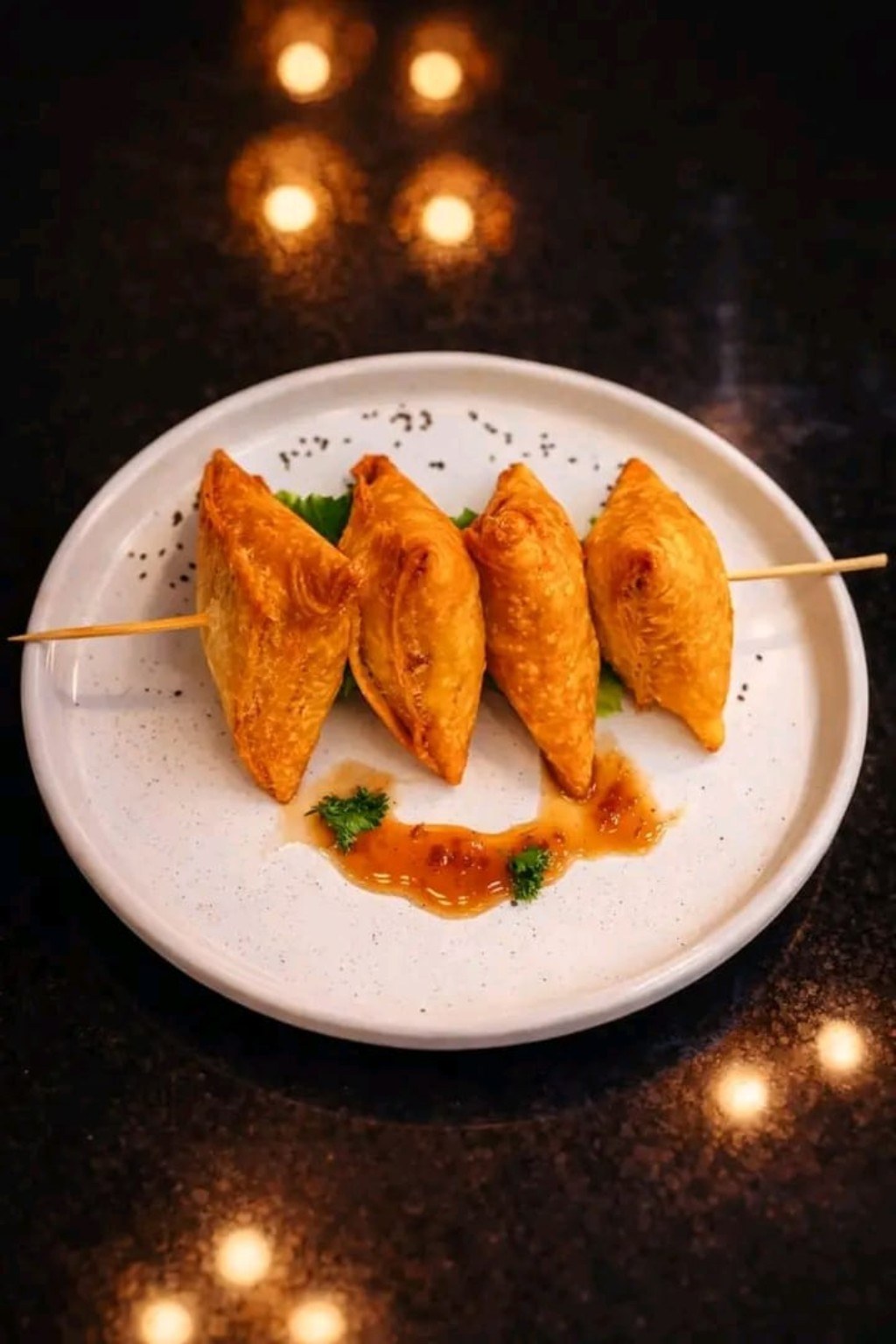 Crisp savoury pastries with a dipping sauce.